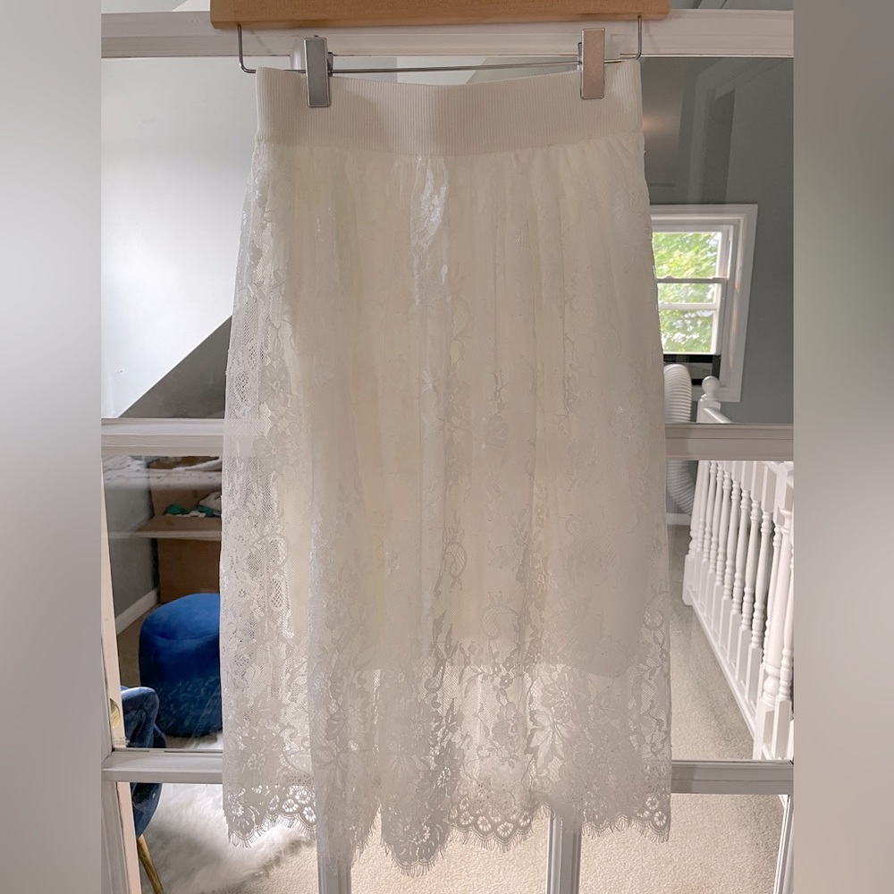 Brand new lacy elegant skirt. Size: small. Lucy Paris. Final sale.